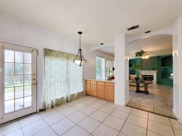 a view of a room window and chairs