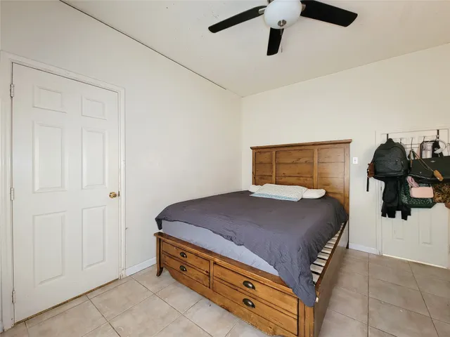 a bedroom with a bed and cabinets
