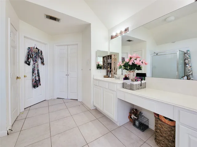 a bathroom with a sink and mirror