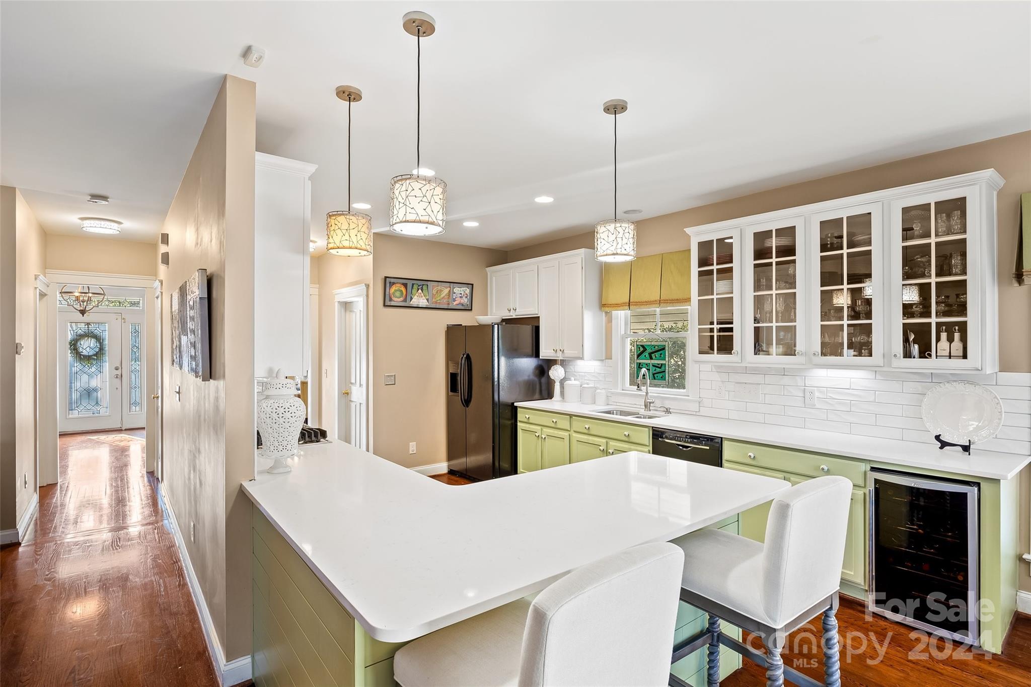 422 Bull Finch Bend Fort Mill, SC 29708 - Photo 11 of 48 a large kitchen with kitchen island a large counter top space and stainless steel appliances