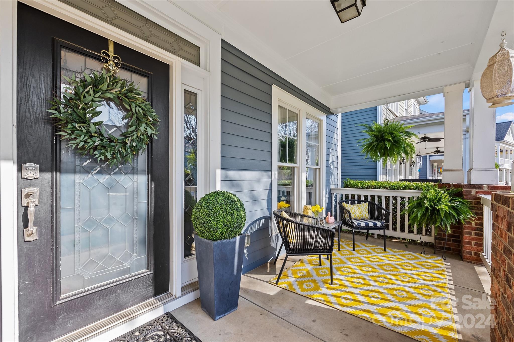 422 Bull Finch Bend Fort Mill, SC 29708 - Photo 2 of 48 a view of balcony with two chairs and a potted plant