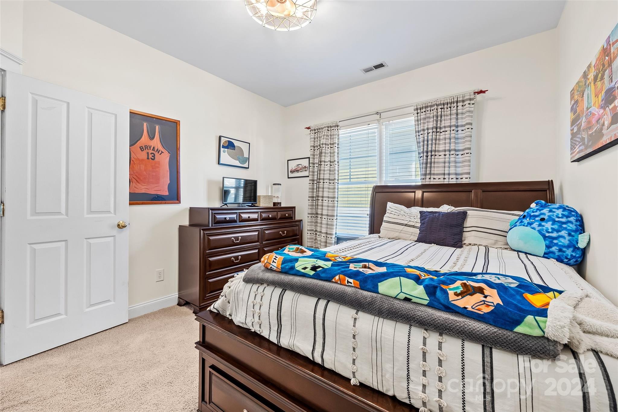 422 Bull Finch Bend Fort Mill, SC 29708 - Photo 24 of 48 a bedroom with furniture and a window