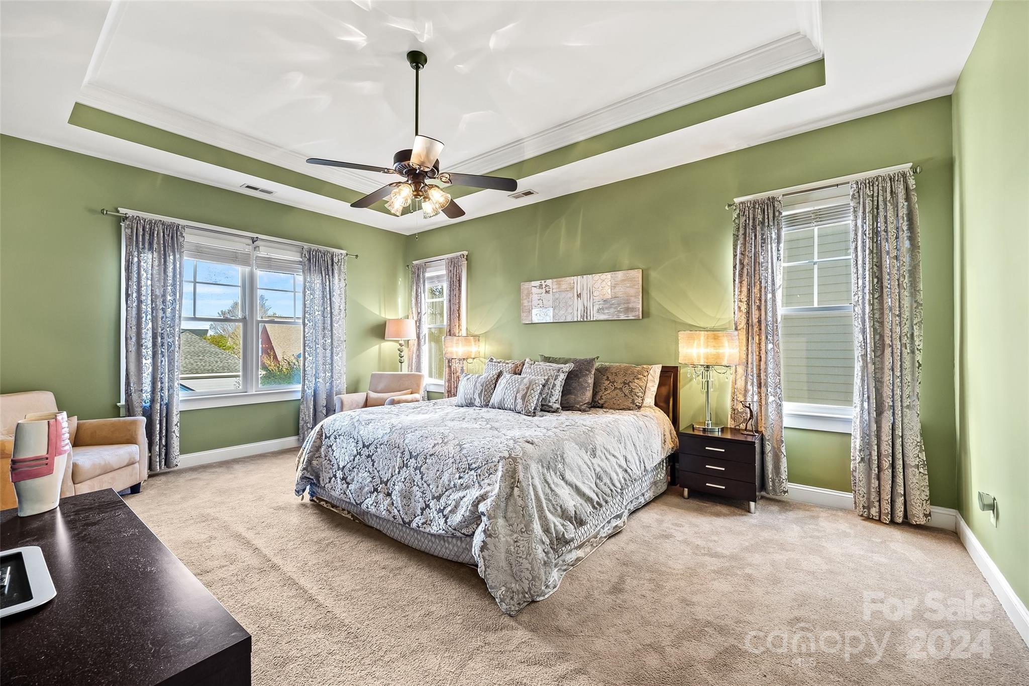 422 Bull Finch Bend Fort Mill, SC 29708 - Photo 25 of 48 a spacious bedroom with a bed and a chandelier