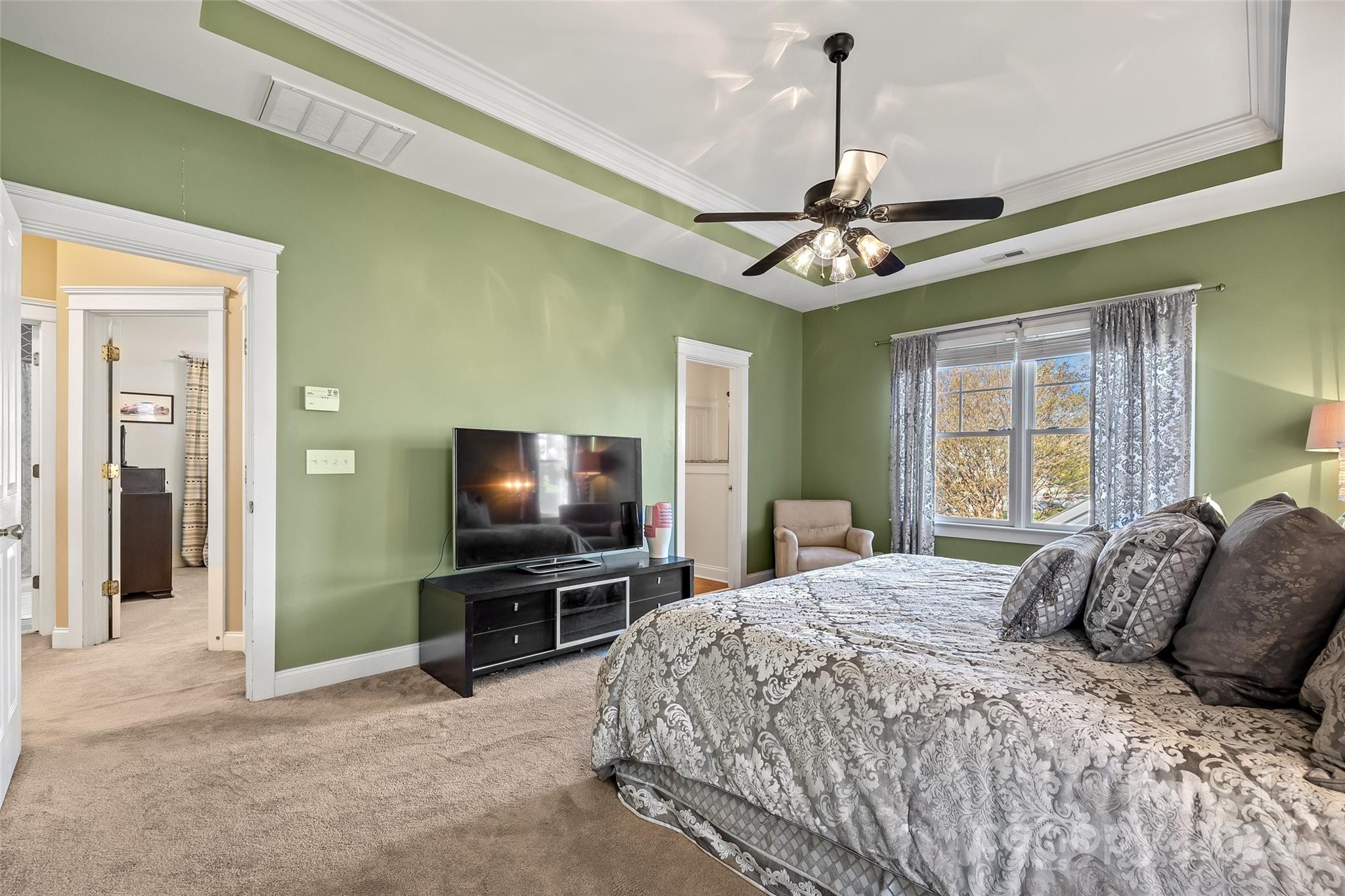 422 Bull Finch Bend Fort Mill, SC 29708 - Photo 26 of 48 a spacious bedroom with a bed and a flat tv screen on dresser