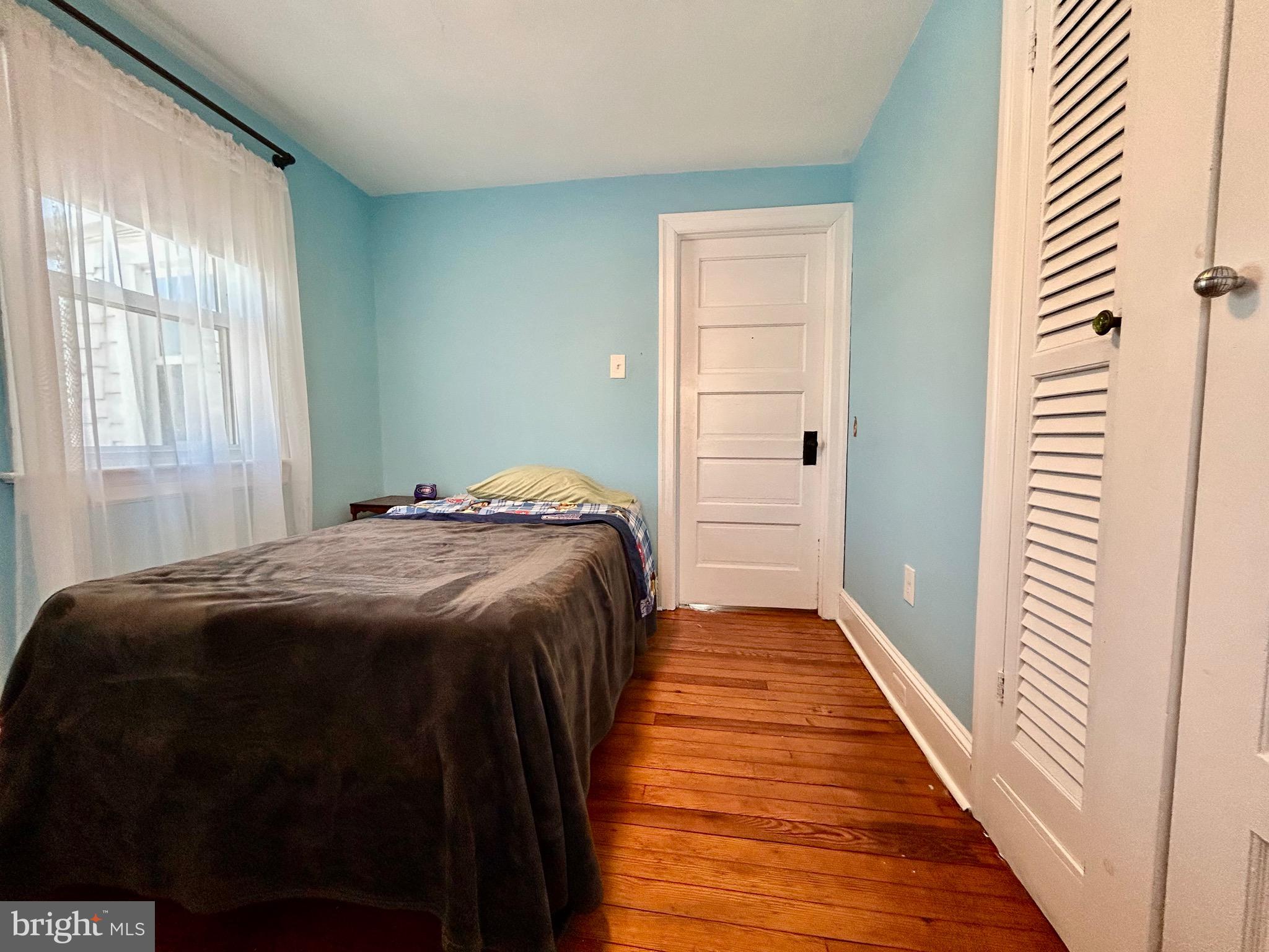 2415 Second Street Pike Newtown, PA 18940 - Photo 29 of 51 a bedroom with a bed and wooden floor