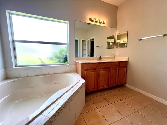 a bathroom with a bathtub and a sink