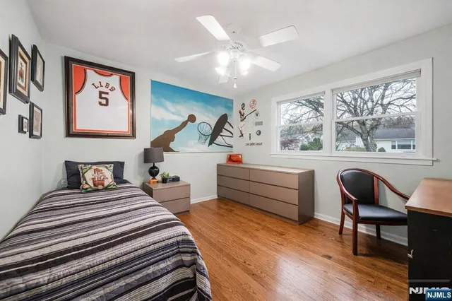 a view of a house with a wooden deck and a chair