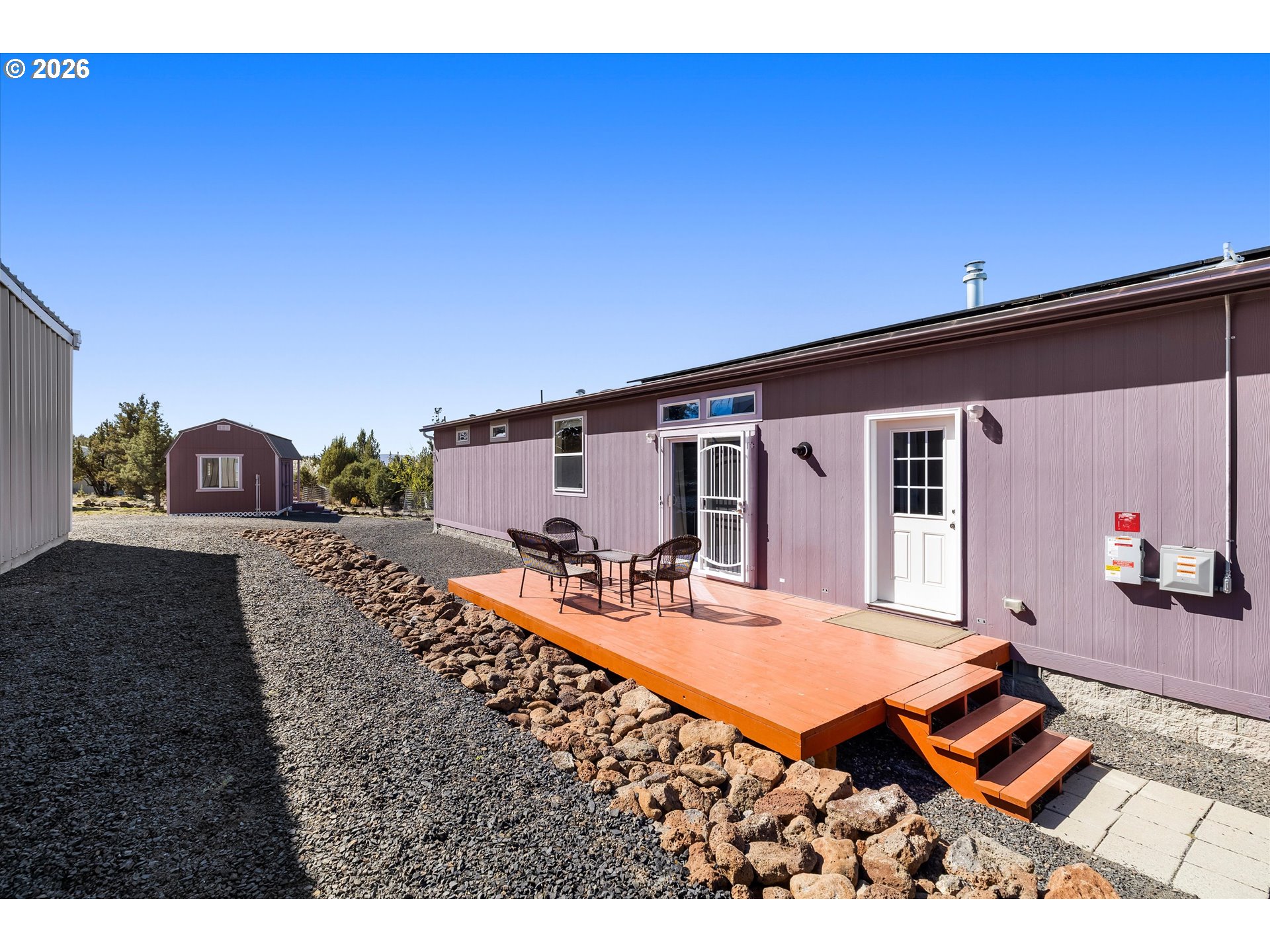 5172 Southeast Oswego Road Prineville, OR 97754 - Photo 37 of 48 a backyard of a house with seating space