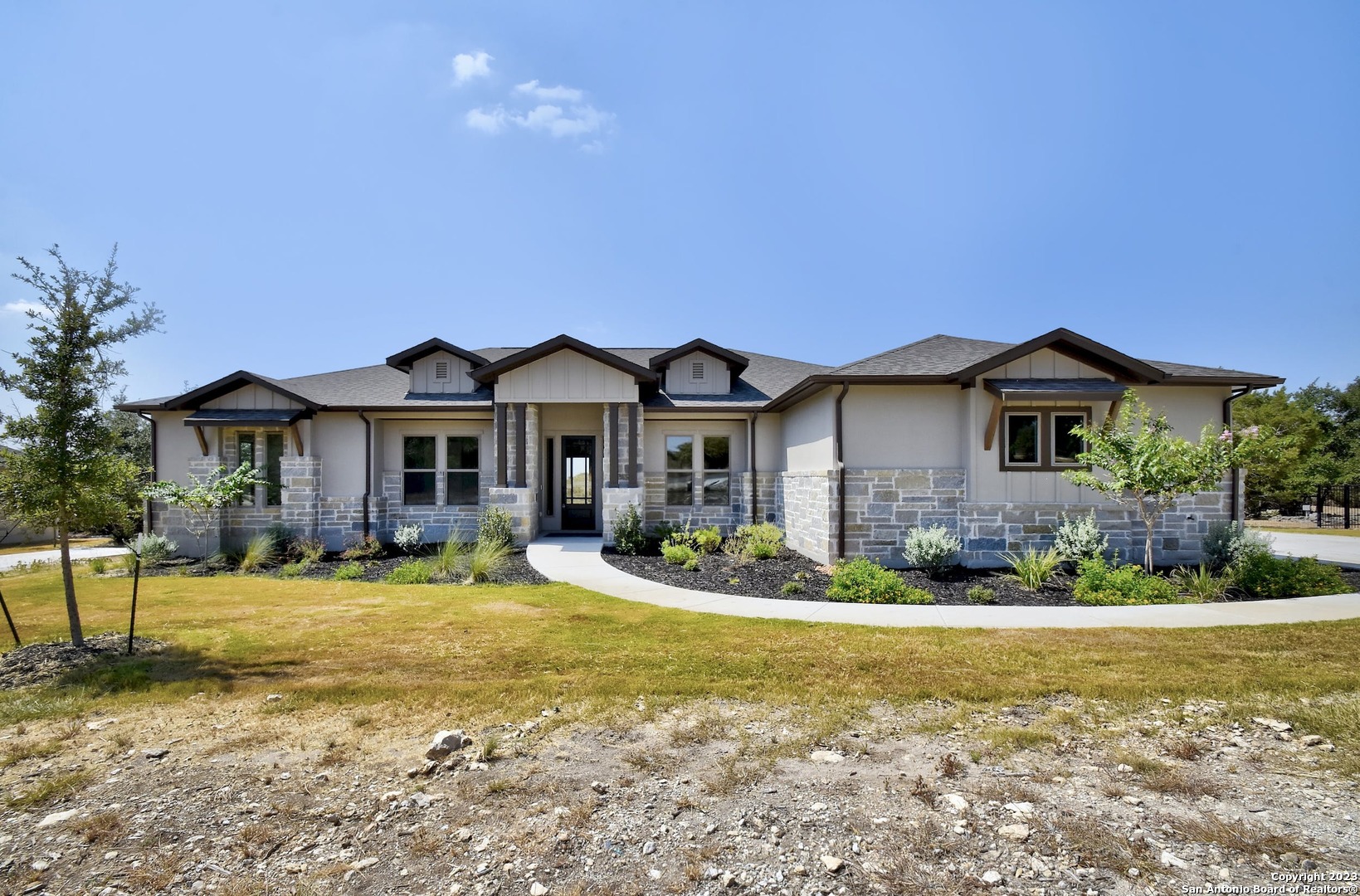a front view of a house with a yard