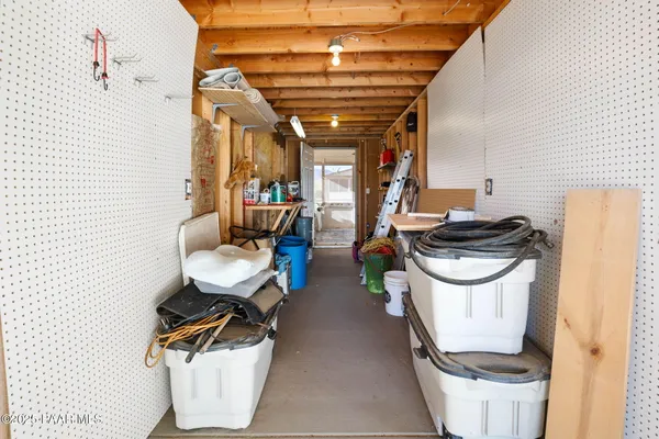 a dining room with furniture and a chandelier