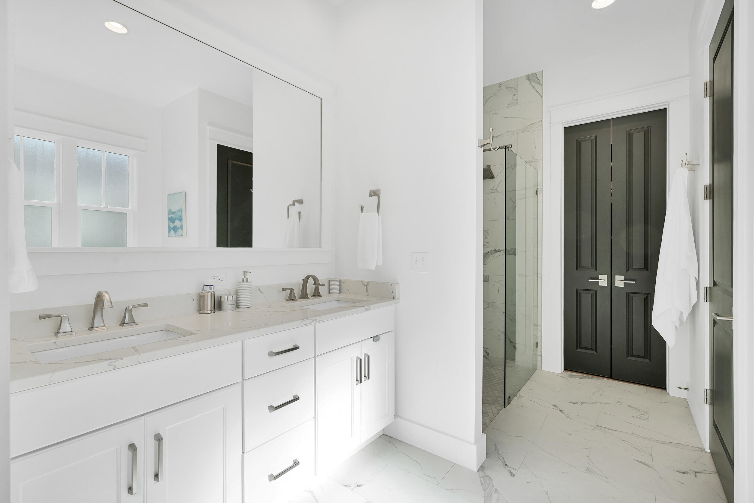 129 Firefly Way, Unit LOT 75 Watersound, FL 32461 - Photo 11 of 56 a en suite bathroom with a granite countertop sink and a mirror