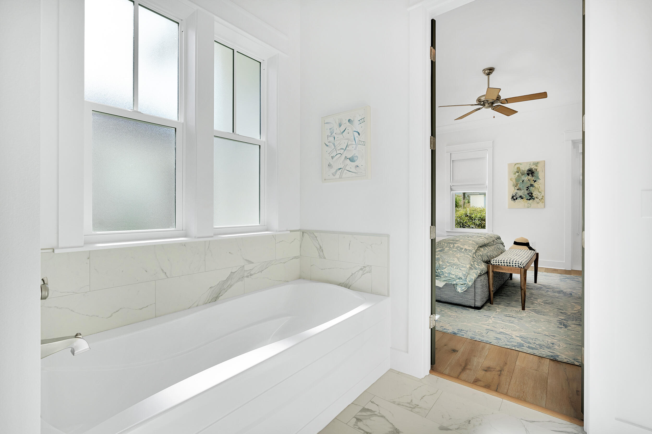 129 Firefly Way, Unit LOT 75 Watersound, FL 32461 - Photo 12 of 56 a bathroom with a bathtub and a window