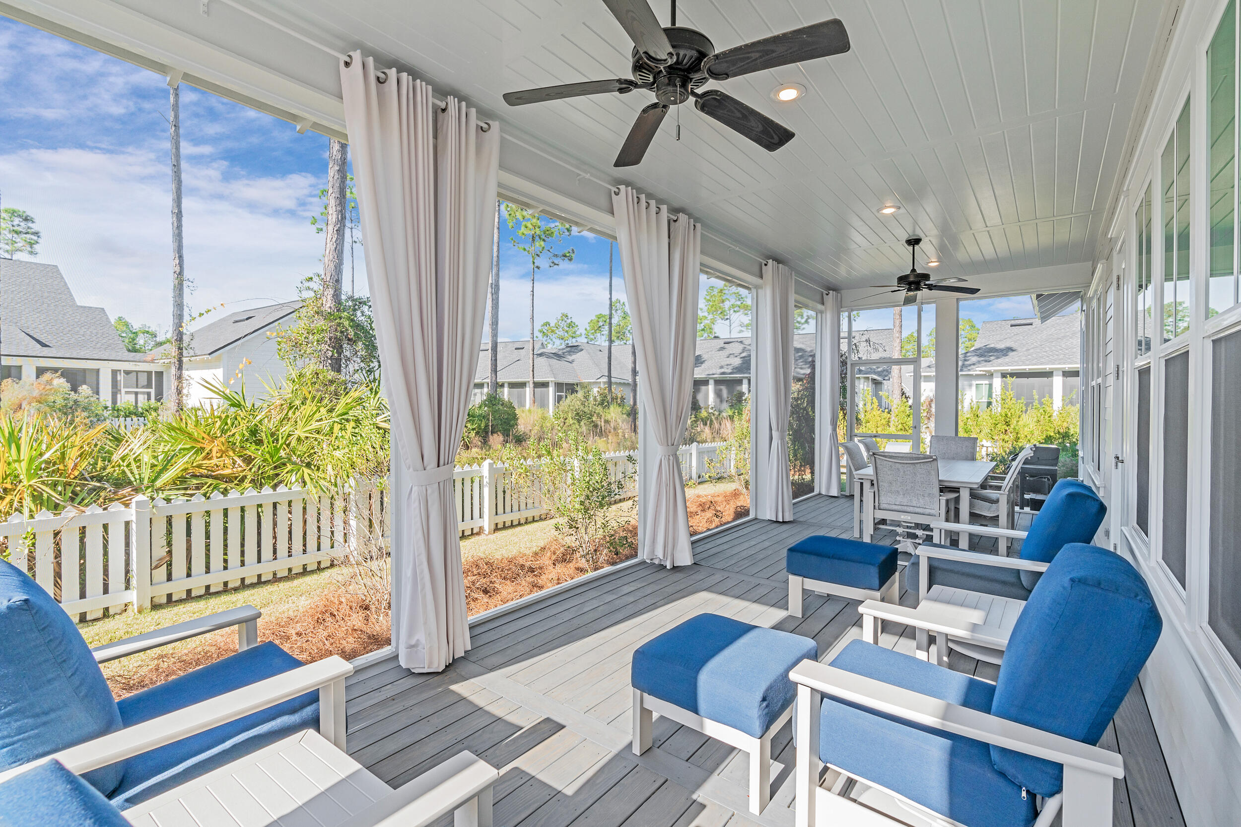 129 Firefly Way, Unit LOT 75 Watersound, FL 32461 - Photo 14 of 56 a living room with furniture and a floor to ceiling window