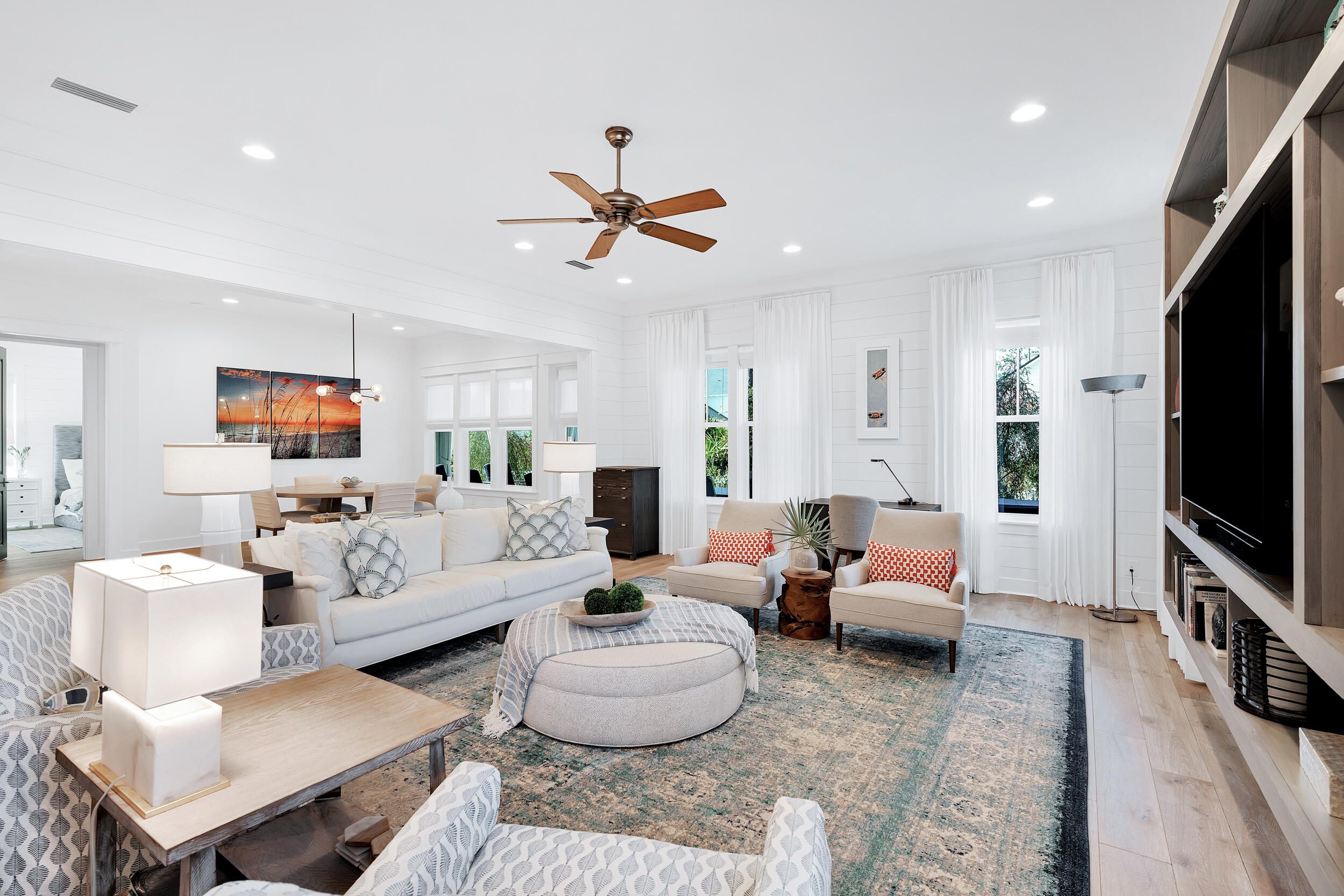 129 Firefly Way, Unit LOT 75 Watersound, FL 32461 - Photo 2 of 56 a living room with furniture a flat screen tv and a window