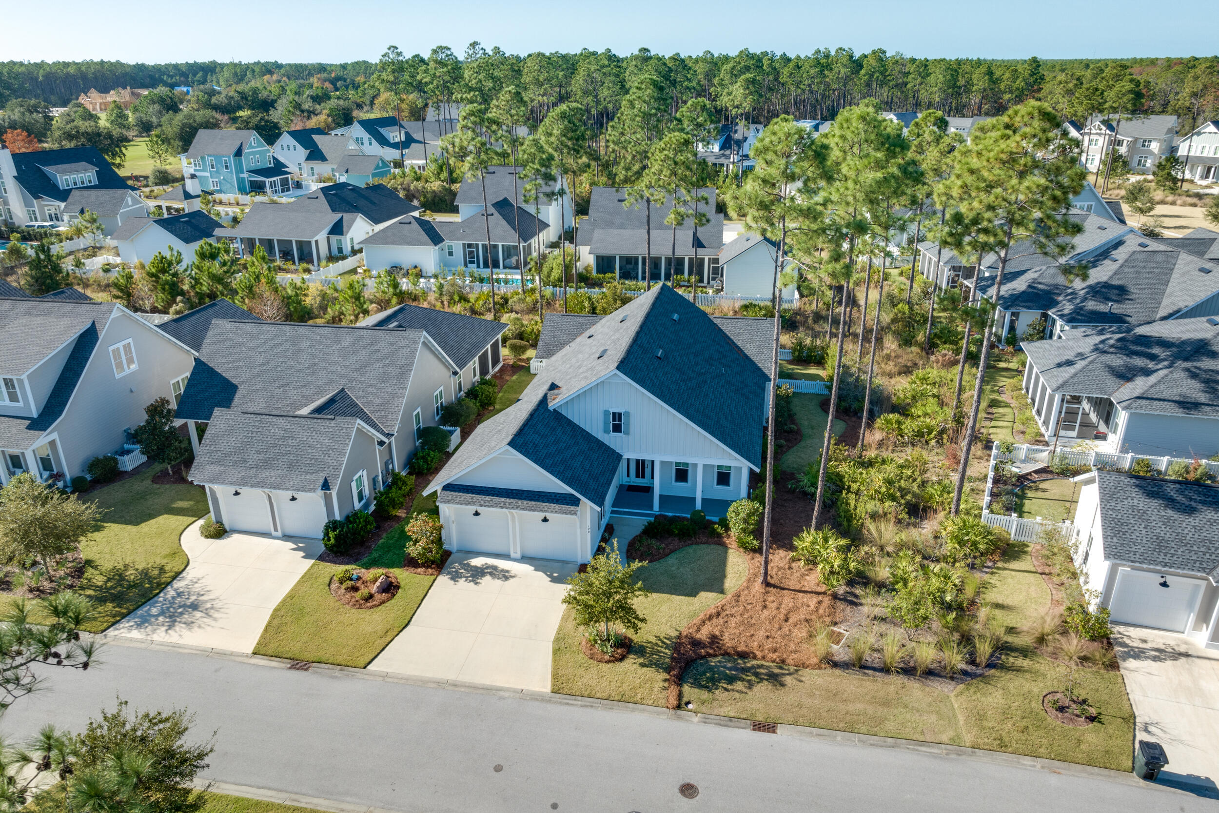 129 Firefly Way, Unit LOT 75 Watersound, FL 32461 - Photo 25 of 56 an aerial view of a house with a yard pool and outdoor seating