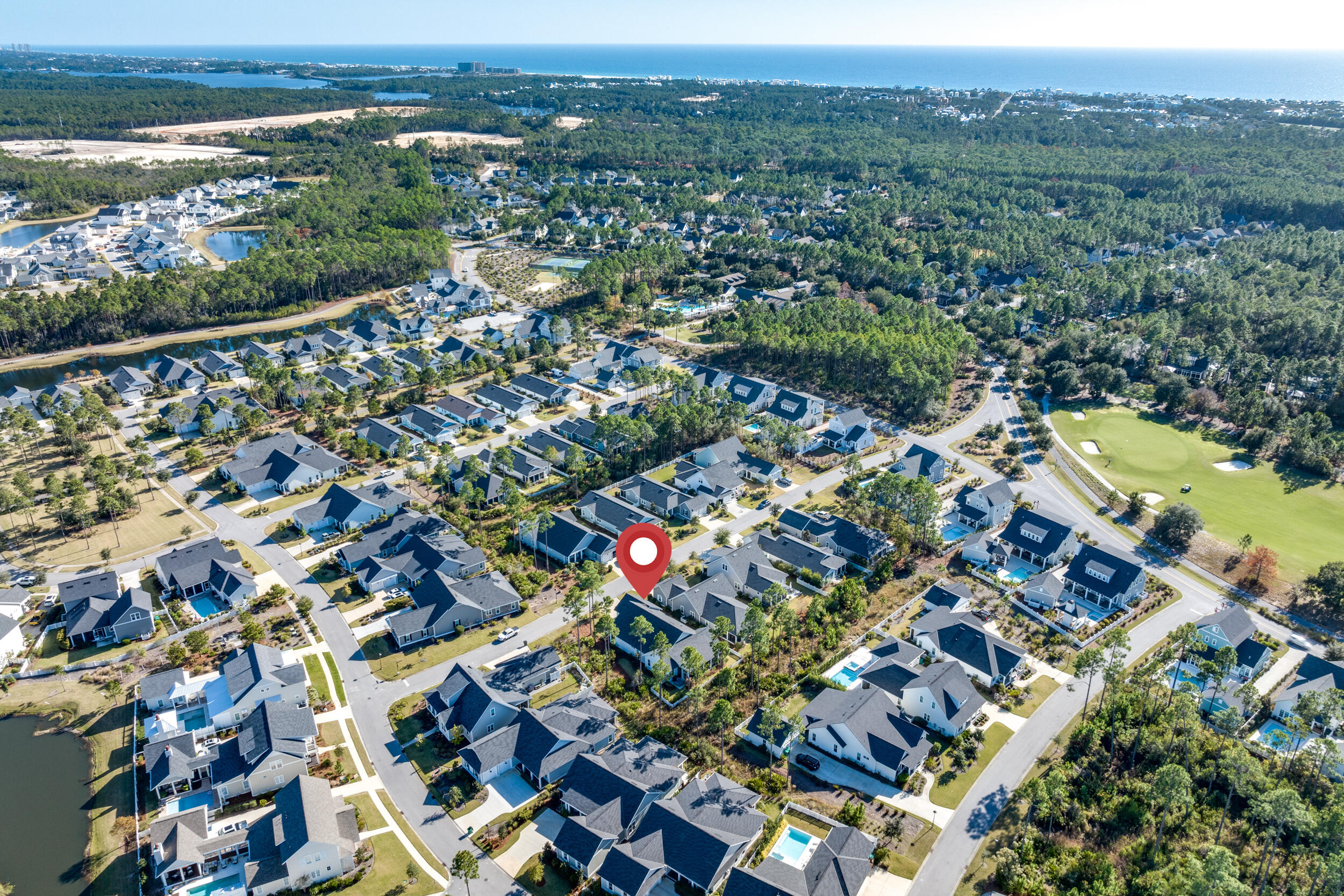 129 Firefly Way, Unit LOT 75 Watersound, FL 32461 - Photo 28 of 56 an aerial view of residential houses with outdoor space and swimming pool