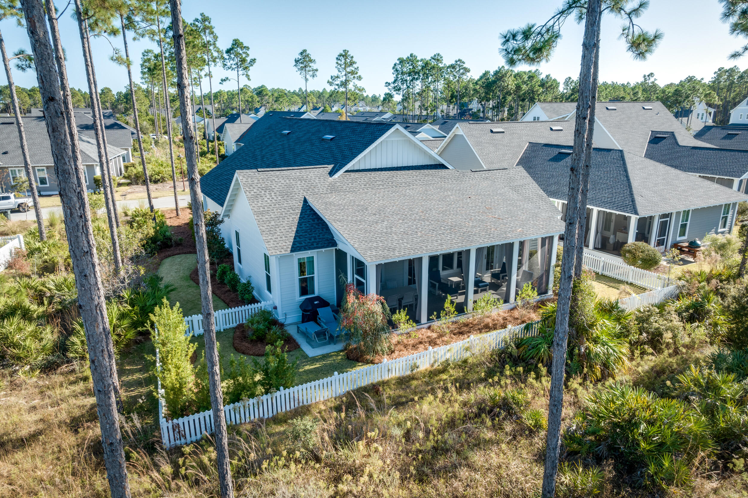 129 Firefly Way, Unit LOT 75 Watersound, FL 32461 - Photo 31 of 56 an aerial view of a house with yard and trees in the background