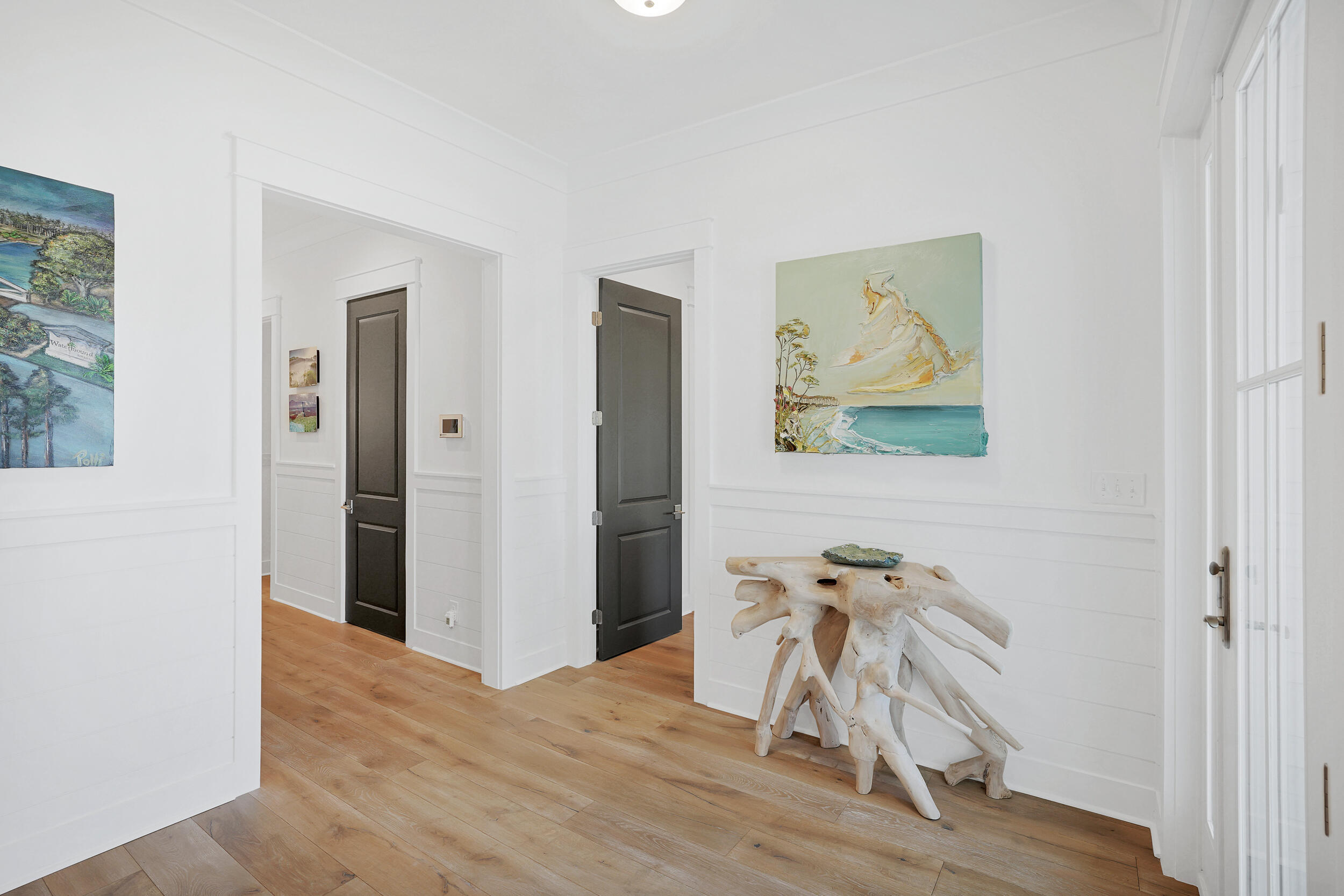 129 Firefly Way, Unit LOT 75 Watersound, FL 32461 - Photo 34 of 56 a view of a livingroom with a dinning area a hardwood floor and a ceiling fan