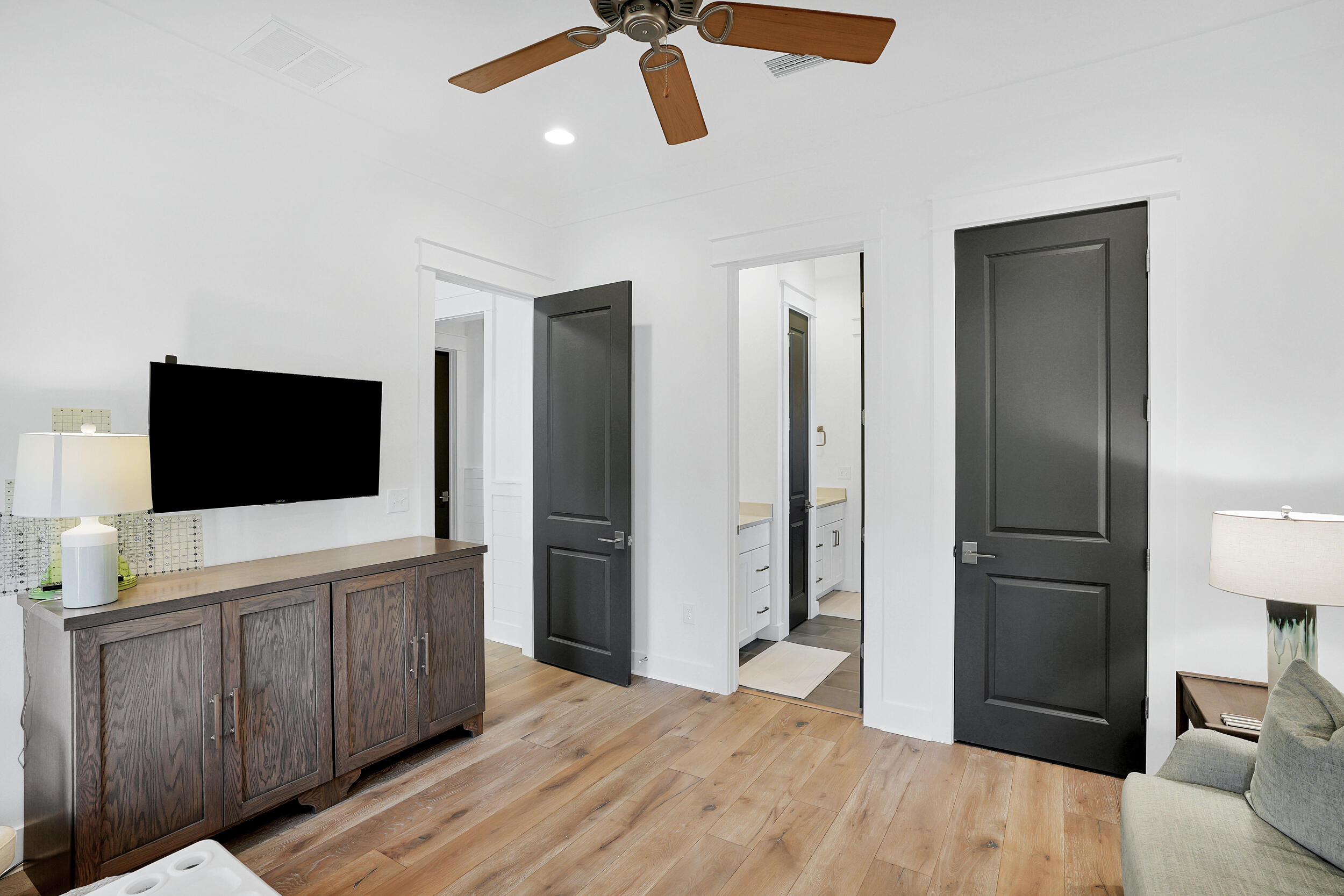 129 Firefly Way, Unit LOT 75 Watersound, FL 32461 - Photo 36 of 56 a hotel room with a bed and a flat screen tv