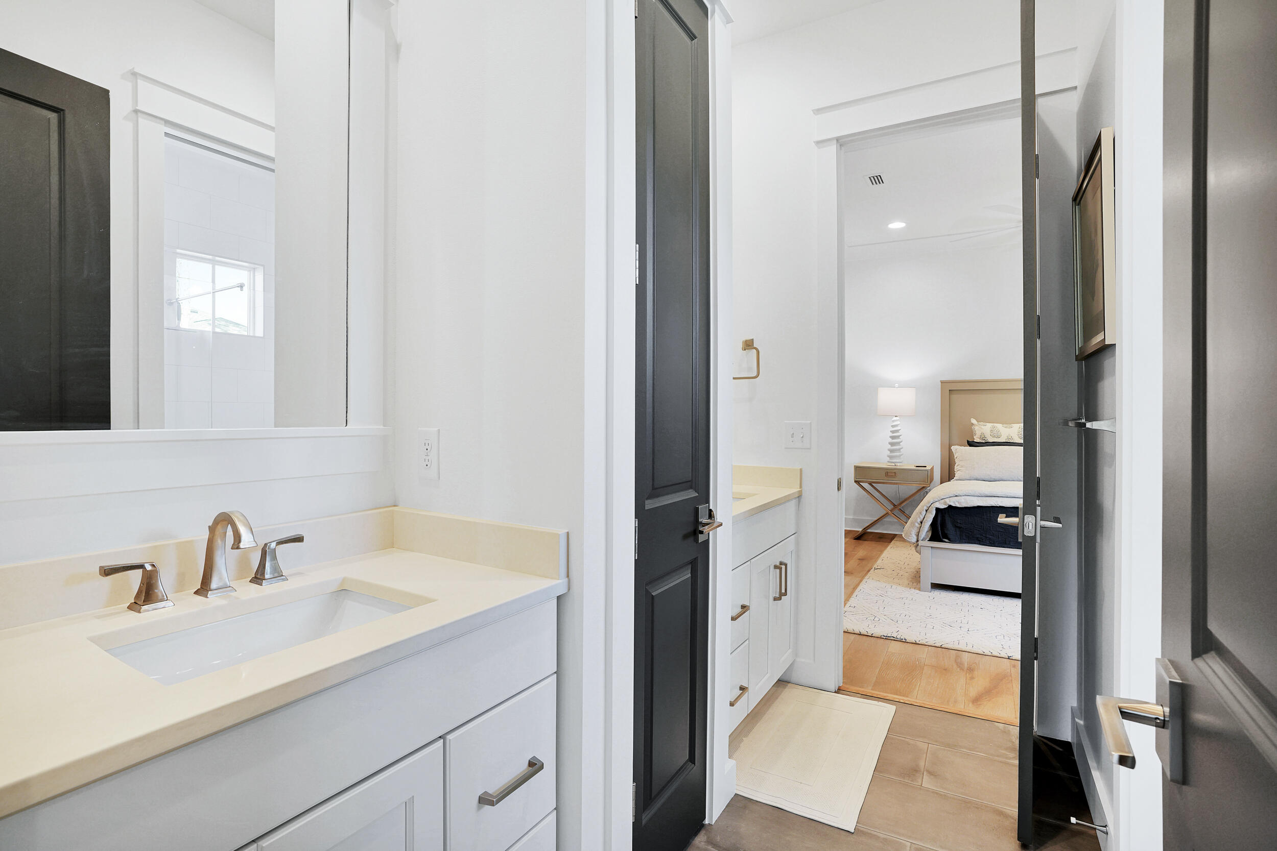 129 Firefly Way, Unit LOT 75 Watersound, FL 32461 - Photo 37 of 56 a en suite bathroom with a sink a mirror and a shower