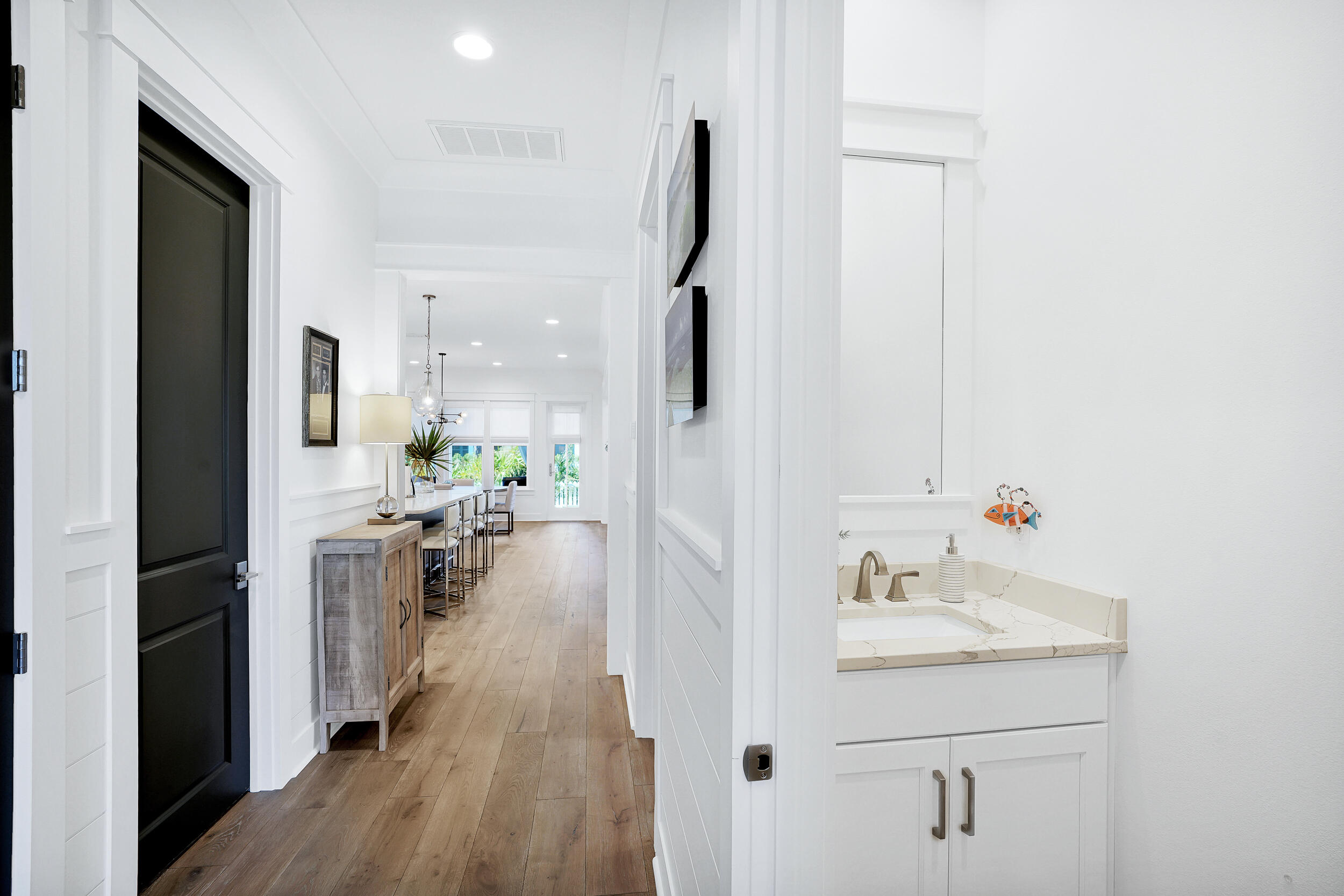 129 Firefly Way, Unit LOT 75 Watersound, FL 32461 - Photo 41 of 56 a bathroom with a sink a mirror and shower