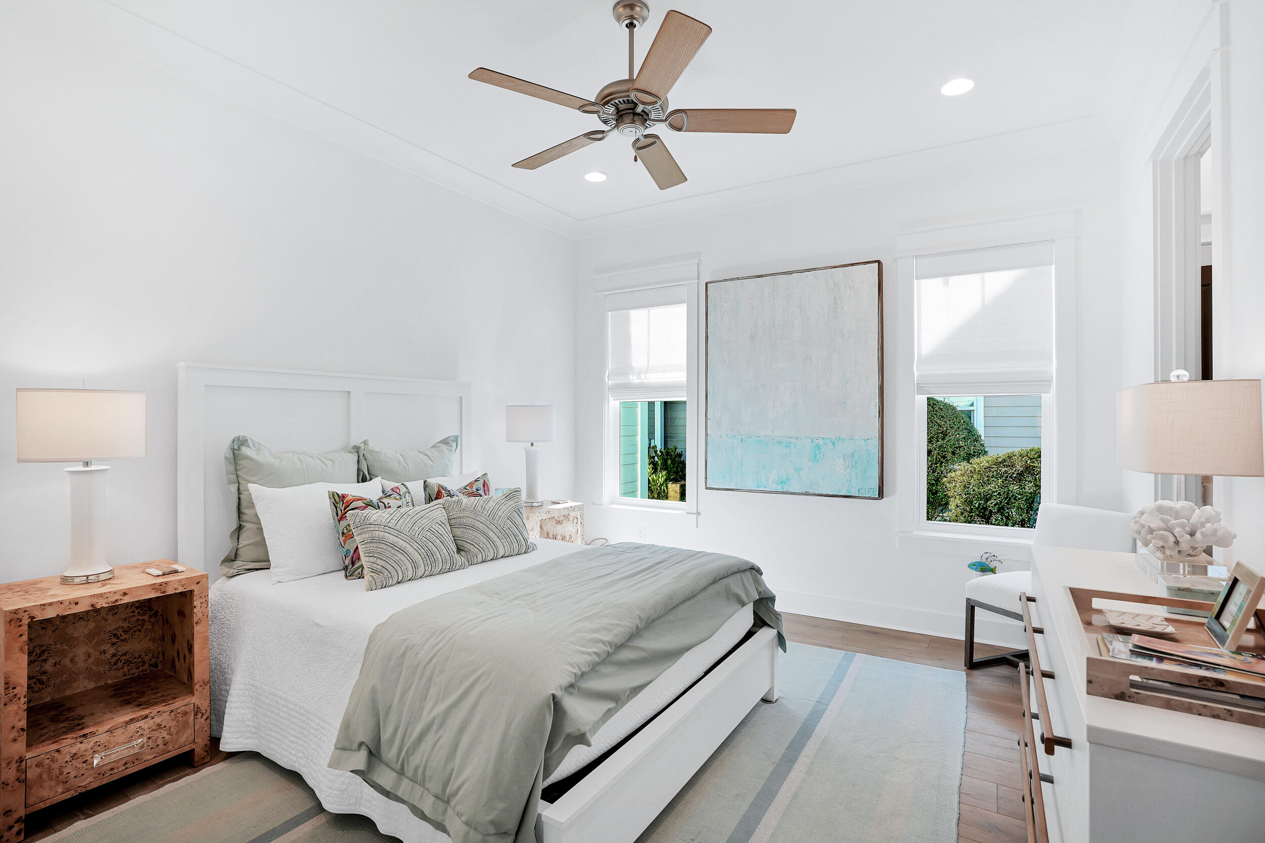 129 Firefly Way, Unit LOT 75 Watersound, FL 32461 - Photo 43 of 56 a bedroom with a bed and a chandelier