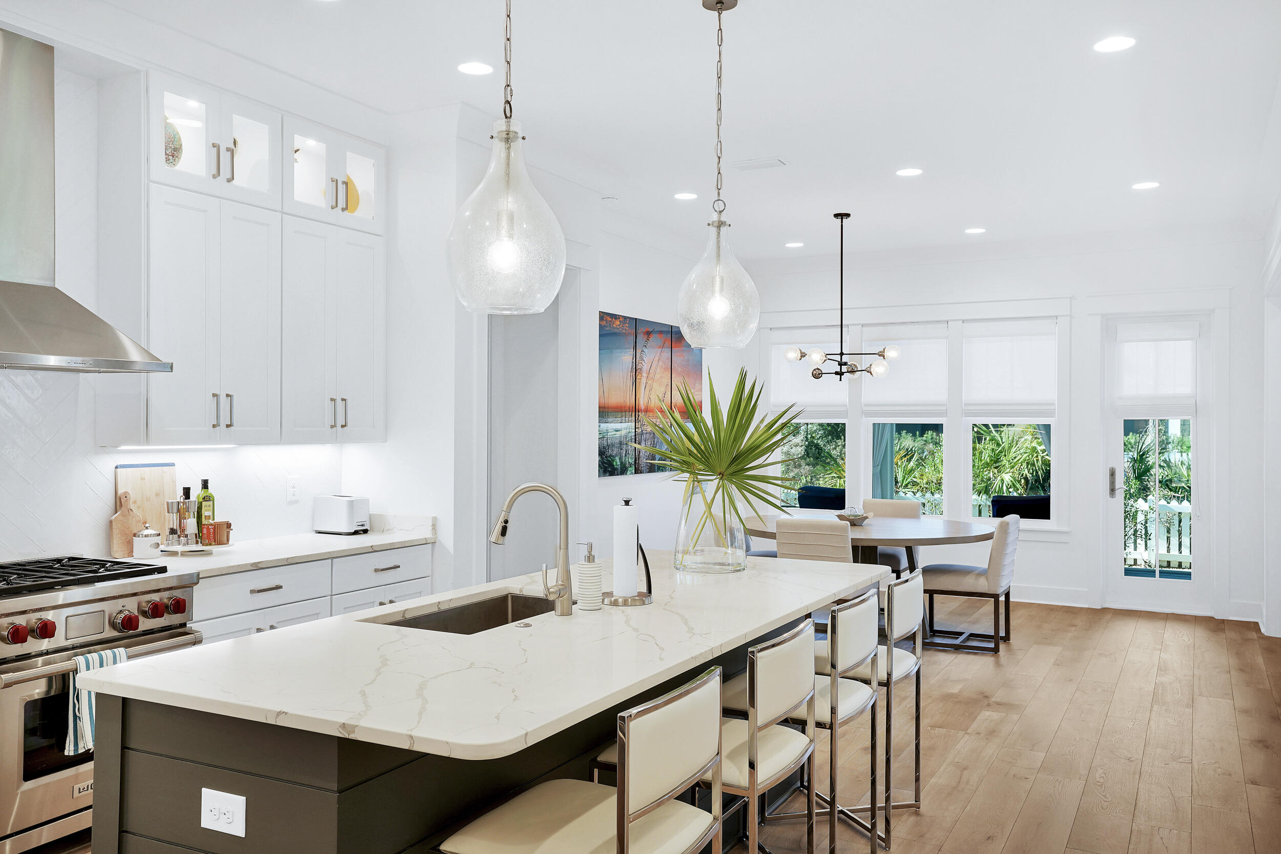 129 Firefly Way, Unit LOT 75 Watersound, FL 32461 - Photo 46 of 56 a kitchen with a table chairs stove and kitchen view