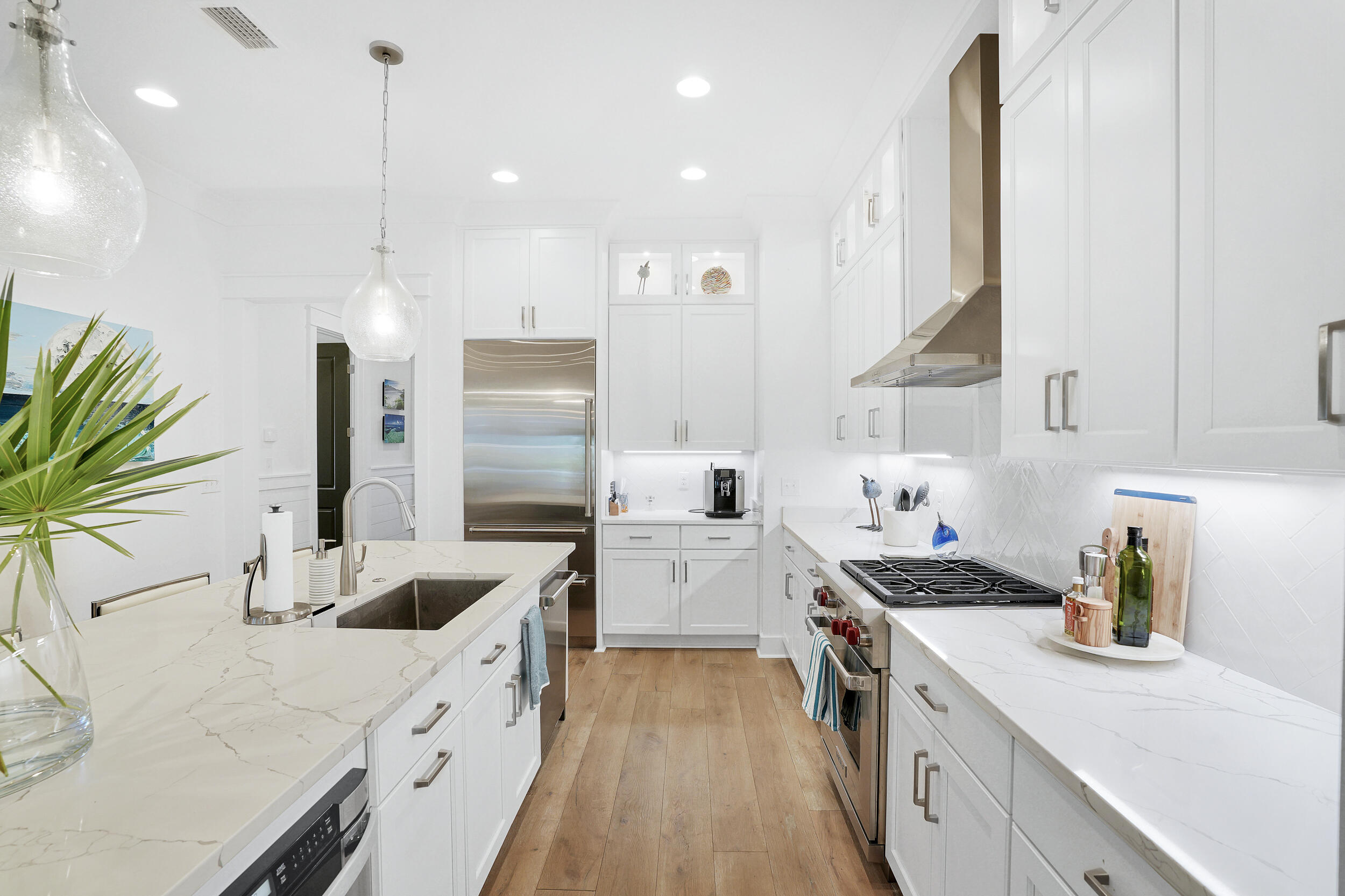 129 Firefly Way, Unit LOT 75 Watersound, FL 32461 - Photo 50 of 56 a kitchen with a sink stove and refrigerator