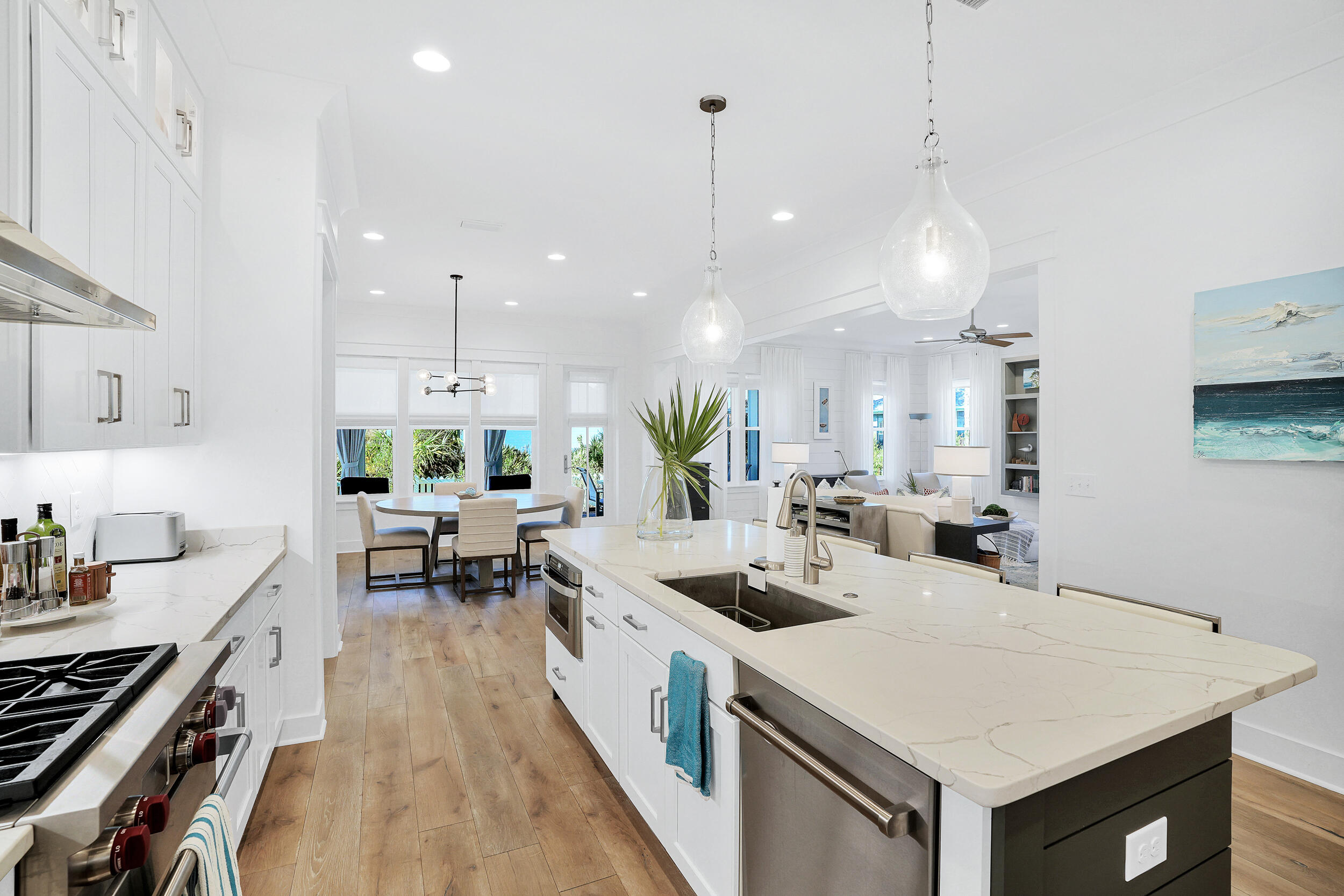 129 Firefly Way, Unit LOT 75 Watersound, FL 32461 - Photo 51 of 56 a kitchen that has a lot of cabinets a sink and appliances in it