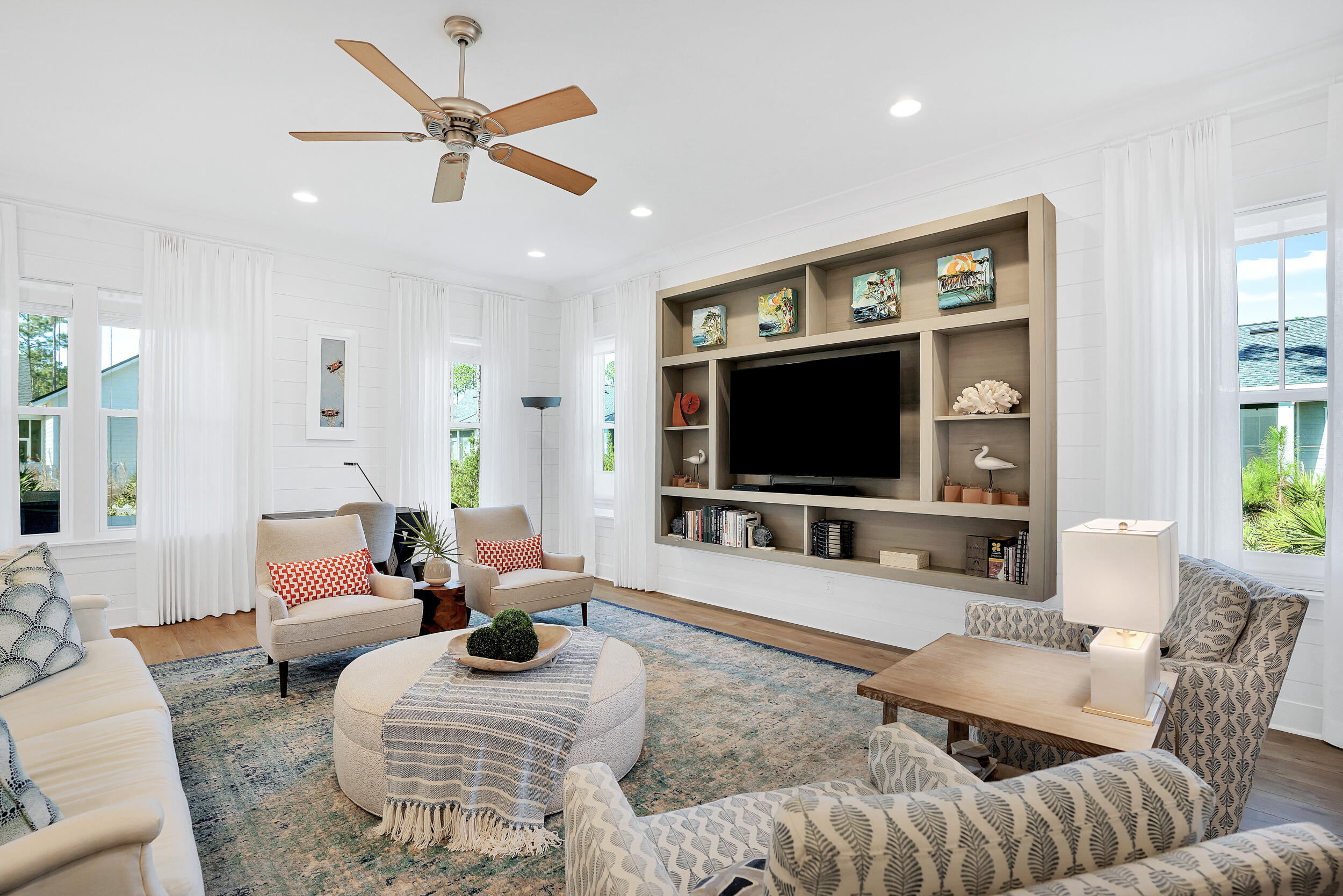 129 Firefly Way, Unit LOT 75 Watersound, FL 32461 - Photo 52 of 56 a living room with furniture and a flat screen tv