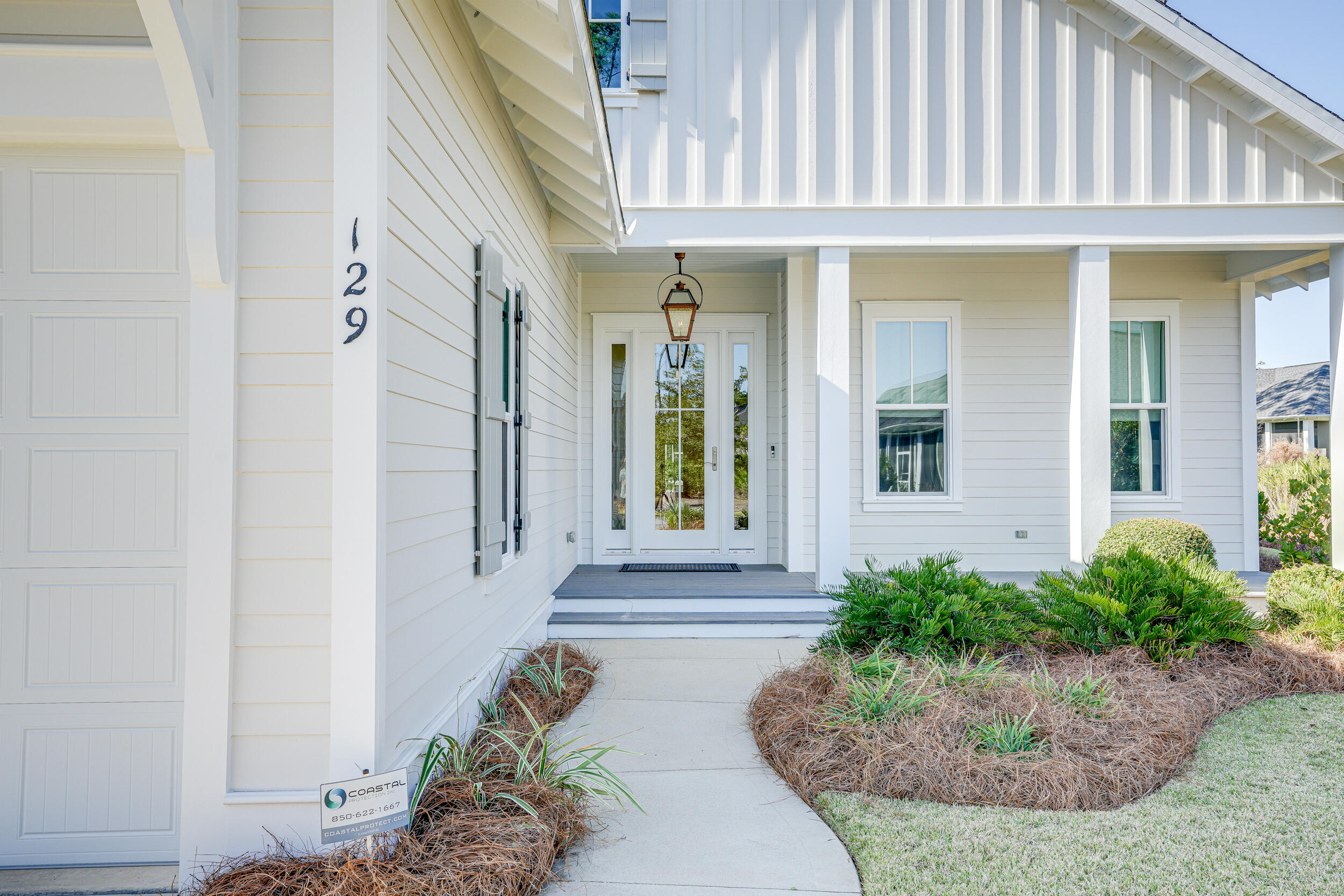 129 Firefly Way, Unit LOT 75 Watersound, FL 32461 - Photo 55 of 56 a view of a house with potted plants