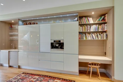 a living room with a bookshelf and a table