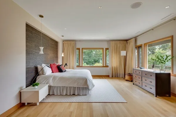 a bed room with a bed and a window