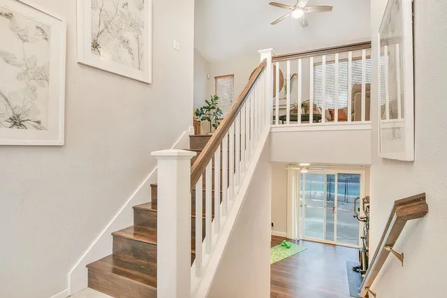 a view of entryway and hall with wooden floor