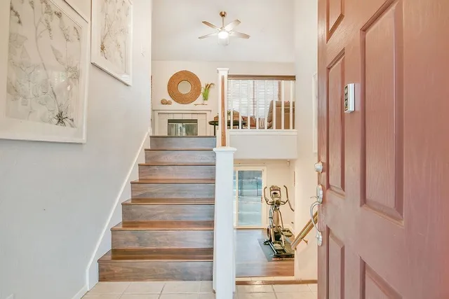 a view of entryway and hall with wooden floor