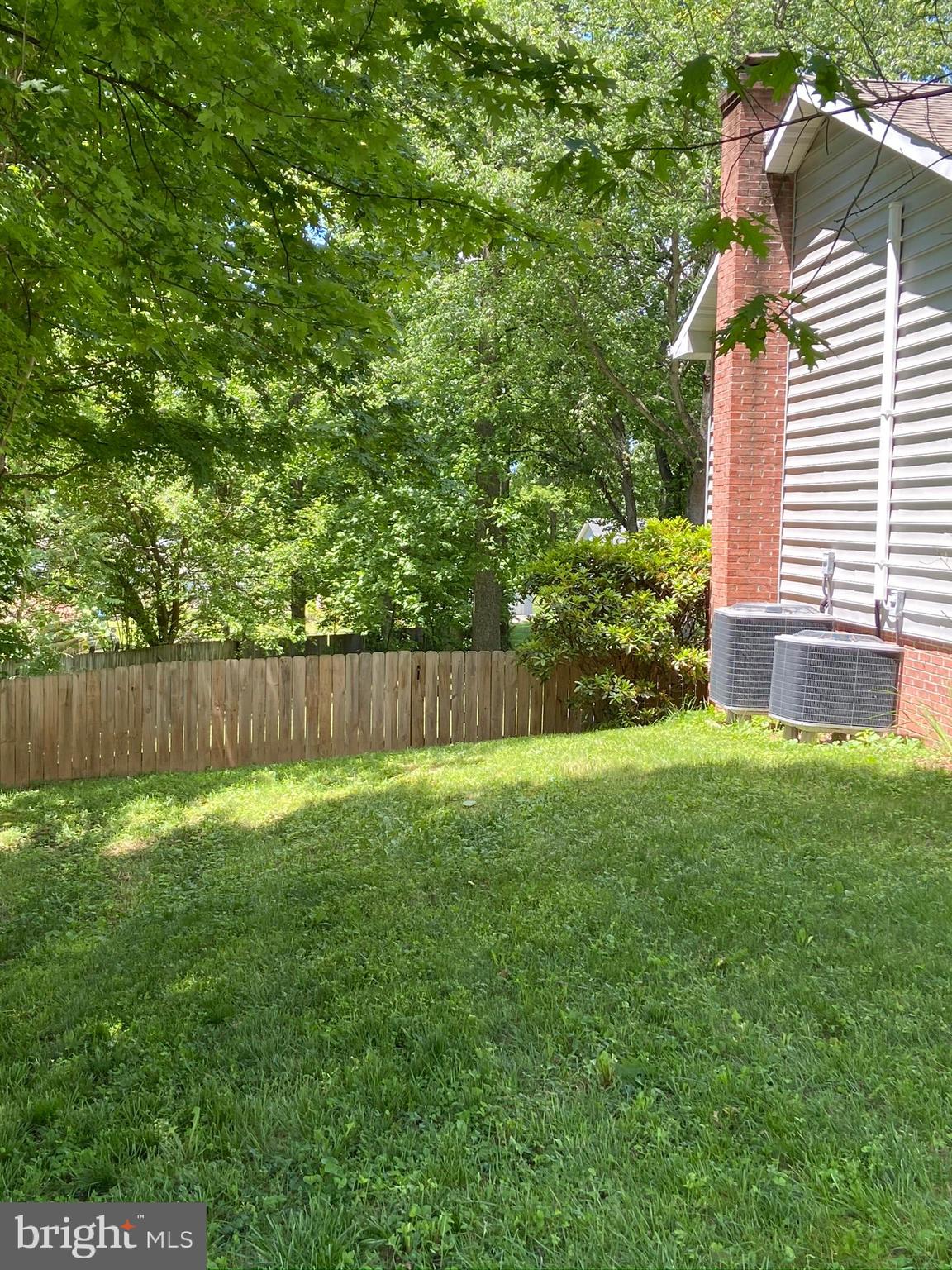 71 Canal Road Falling Waters, WV 25419 - Photo 3 of 38 Left side of house with gate to backyard.