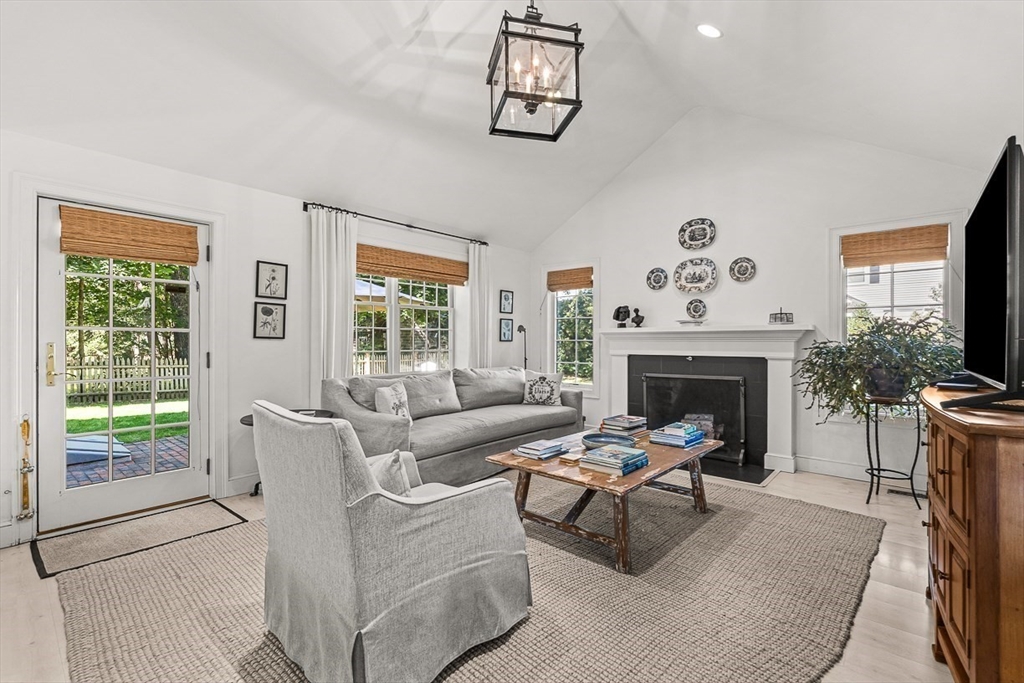 61 Mayo Road Wellesley, MA 02482 - Photo 12 of 23 a living room with furniture a window and a fireplace