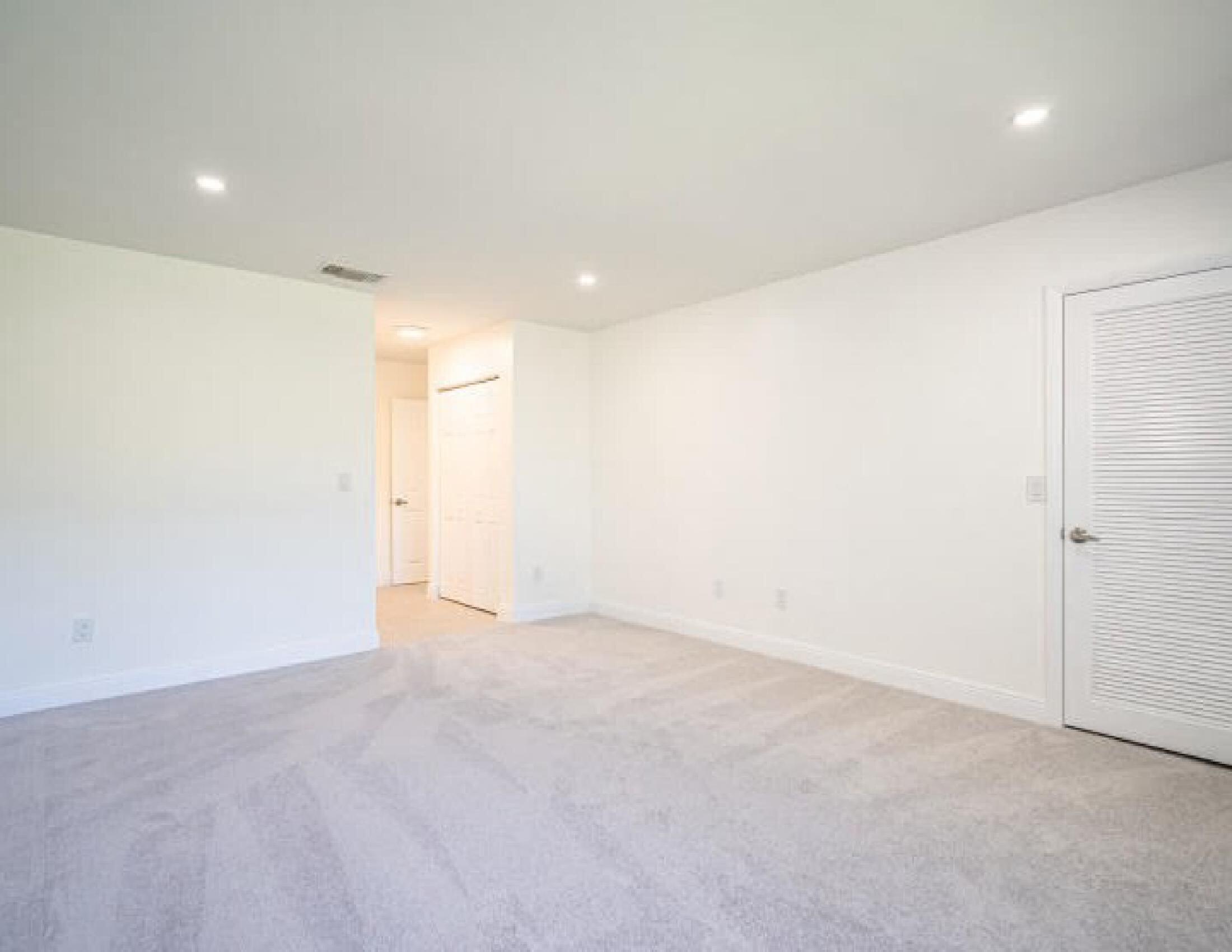 9284 Vista Del Lago, Unit 34F Boca Raton, FL 33428 - Photo 11 of 15 an empty room with an entryway