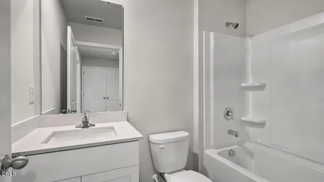 a bathroom with a shower and a shower head
