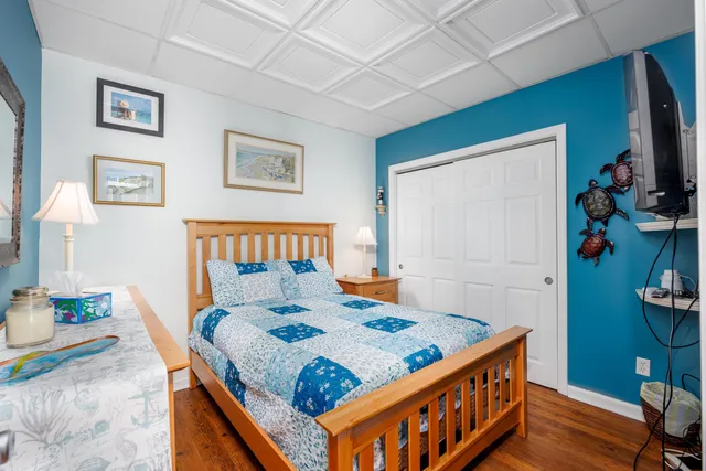 a bedroom with a bed and a table in it