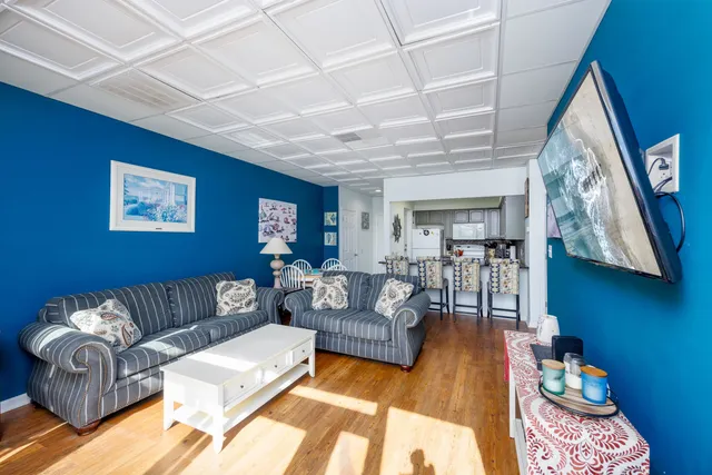 a living room with furniture and a rug