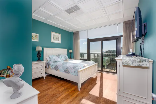 a spacious bedroom with a bed and a large window