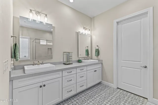 a spacious bedroom with a bed and a table in it