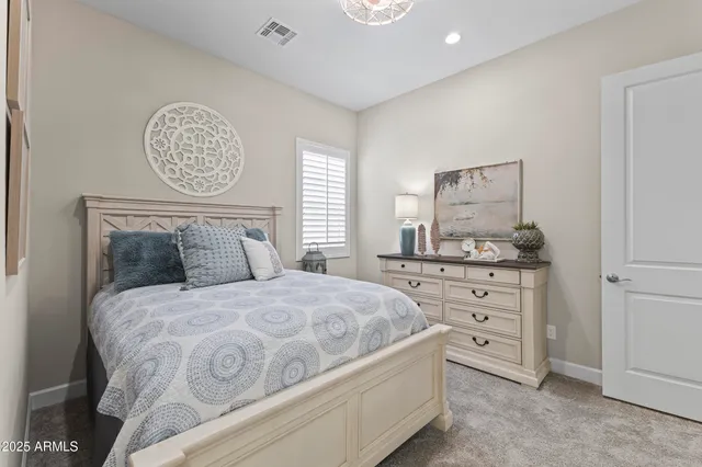 a view of a patio with couches table and chairs with wooden floor and fence