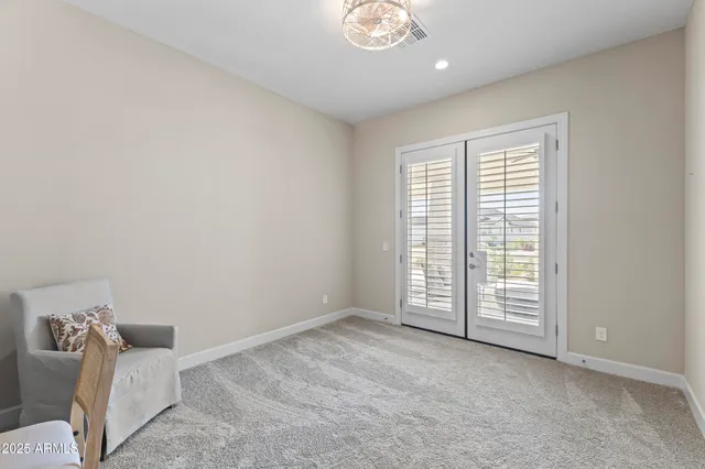 a bathroom with double vanity sinks a mirror a vanity and a shower