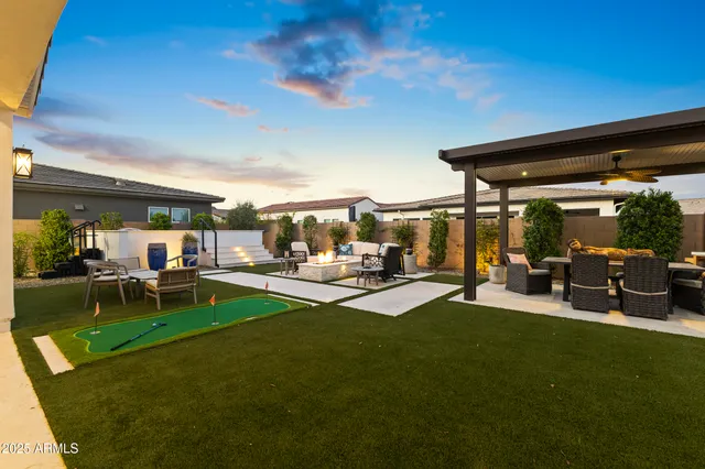 an aerial view of a house with a mountain