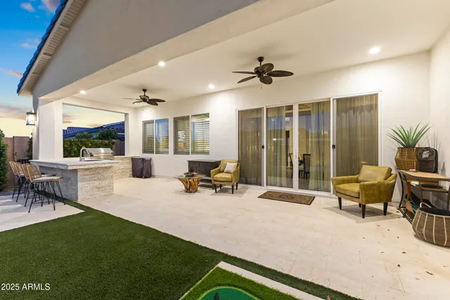 an aerial view of a house with garden space and ocean view