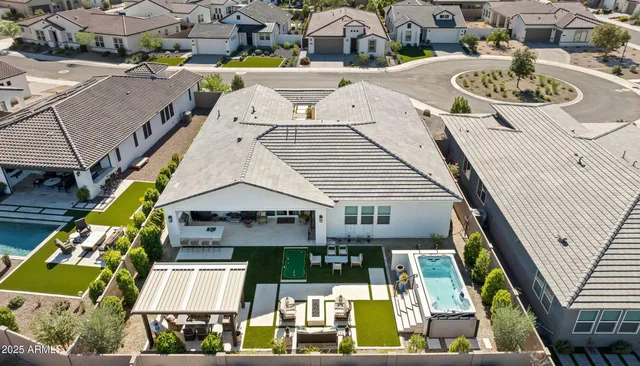 an aerial view of residential houses with outdoor space