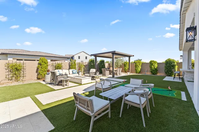 a view of an chairs and table in the balcony
