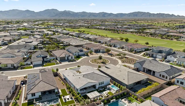 a bedroom with a bed and a chair in it